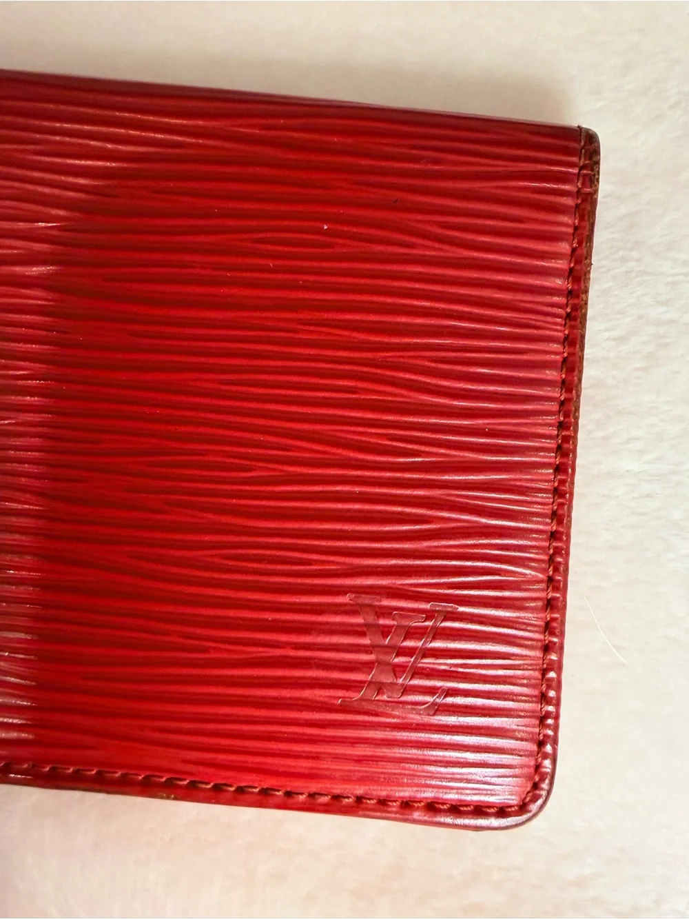 Signature Louis Vuitton textured Epi leather slim wallet